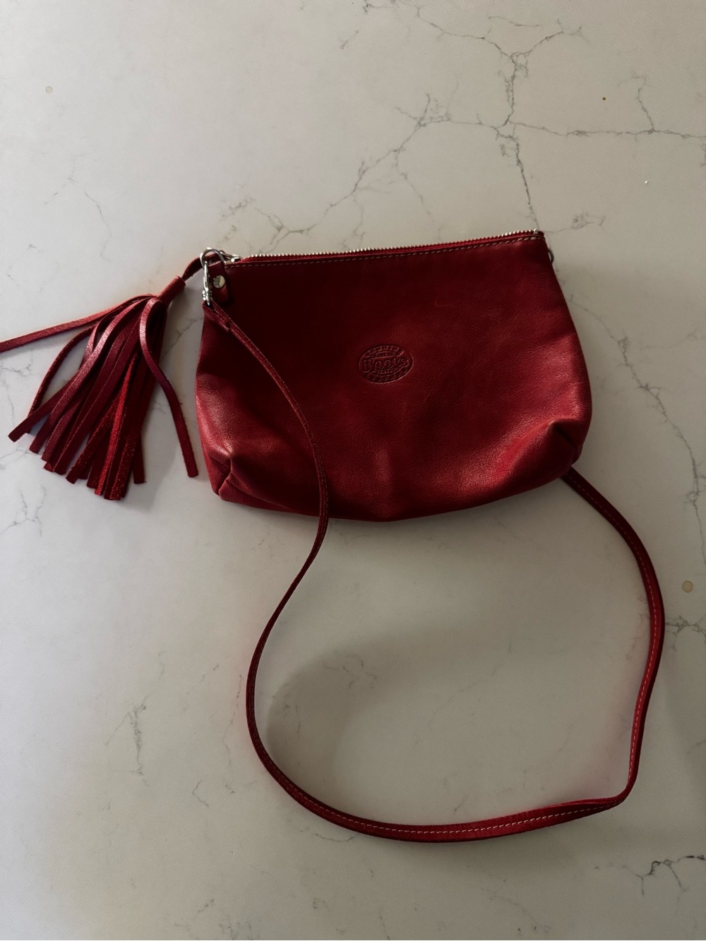Roots Red Leather Crossbody Bag with Tassel